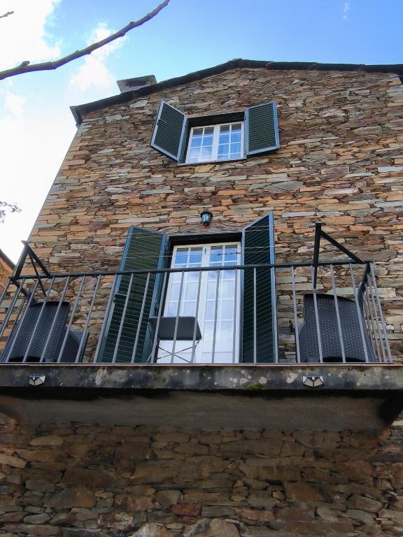 dreams-in-xisto-balcony-stone-facade-green-shutters-piodao-portugal