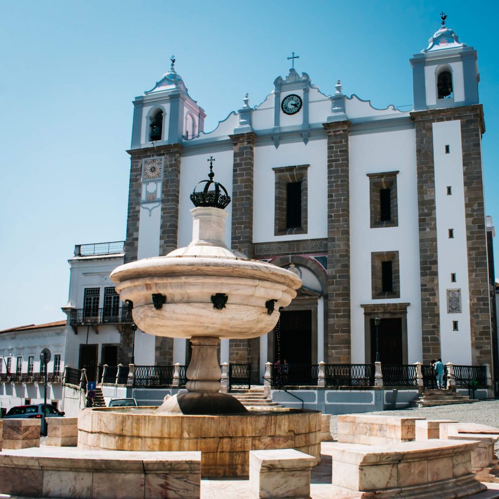 evora-main-square-fountain-and-church