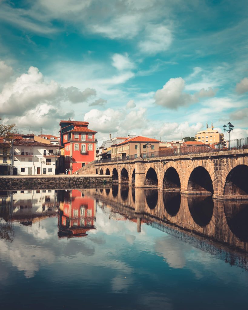 colorful-houses-and-stone-bridge-chaves-tamega-river-portugal
